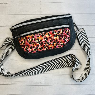 dark gray black waxed canvas and pink red clamshell curved fanny pack