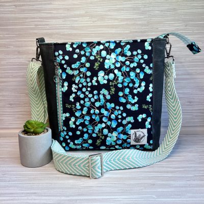 botanical eucalyptus print crossbody messenger bag in aqua blue and black