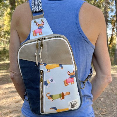 andmade canvas sling bag with cute dog print worn crossbody outdoors – stylish small backpack for women and dog lovers.